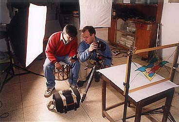 Munish Khanna demonstrates the technique of shooting the glass to one of the students